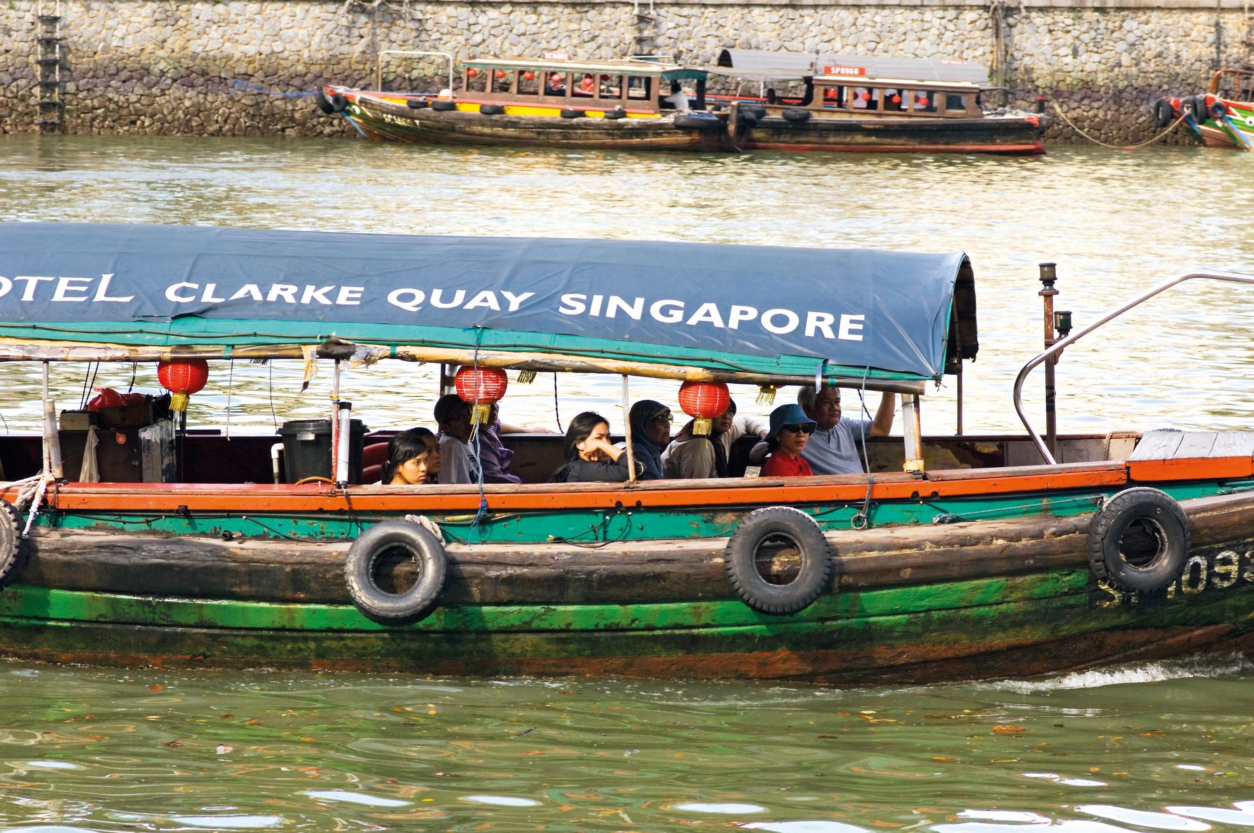 Figure 2: A boat carrying tourists along the Singapore River near Clarke Quay, 2006. © Erick Danzer/OnAsia.com